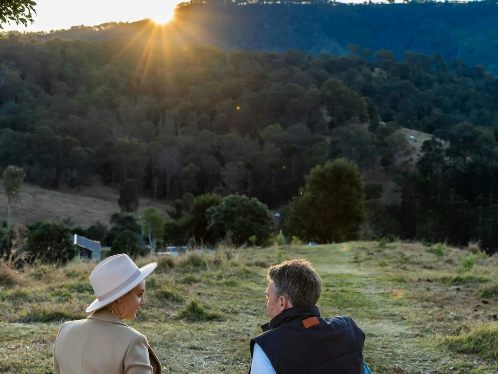 Couple having a picnic, taking the view of Country Mile Escape