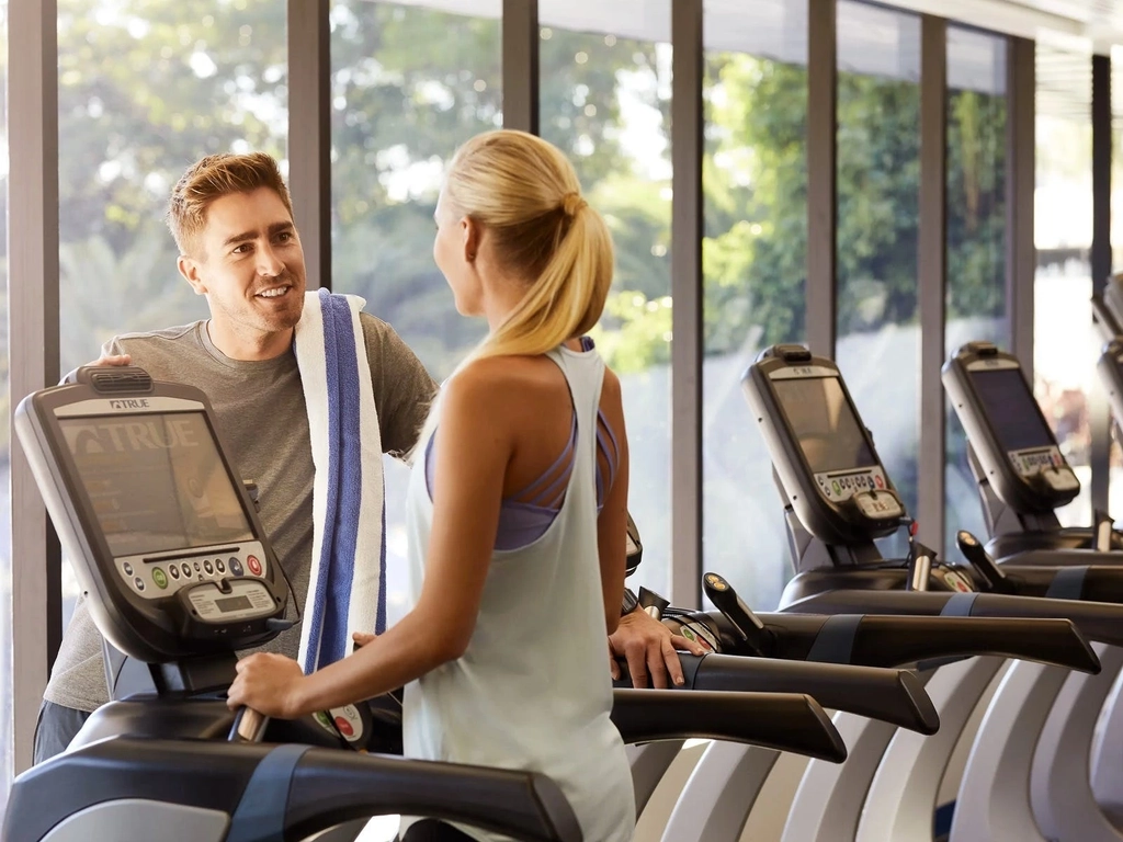 Woman and man socialising at One Lifestyle gym