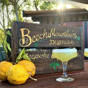 two Lemon Myrtle cocktails, a bunch of lemons and a crate reading "Bespoke & Fabulous"