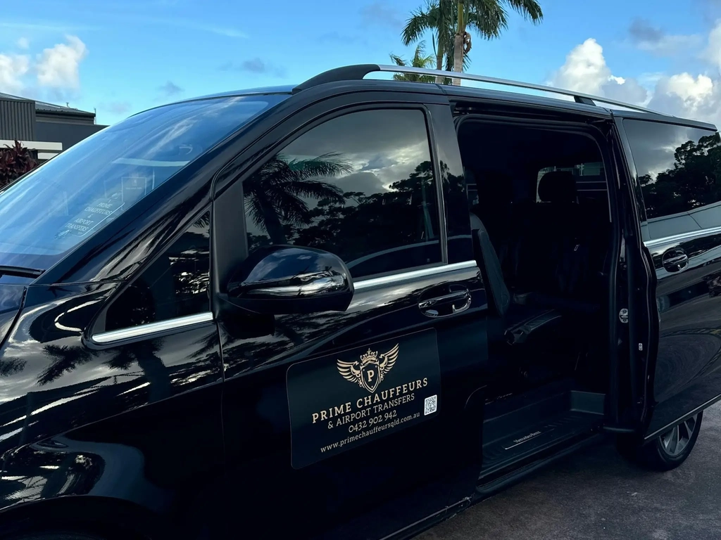Professional chauffeur awaiting VIP client for airport transfer in Brisbane.