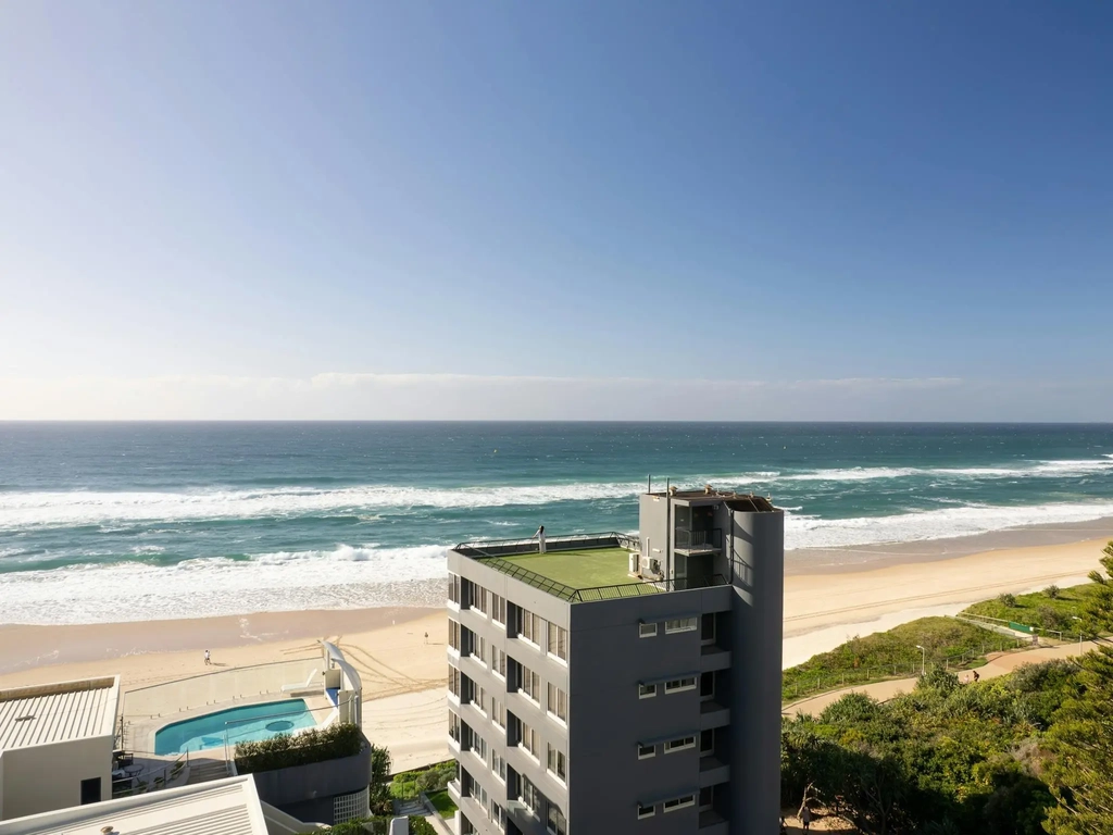 Beachfront apartment building on the sand at Main Beach with rooftop terrace