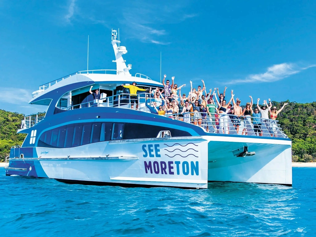 Three  level luxury catamaran on blue water at Moreton Island