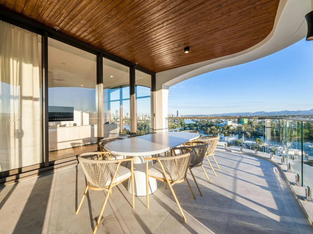 Curved terrace with a timber arch overlooking the river and Surfers Paradise skyline