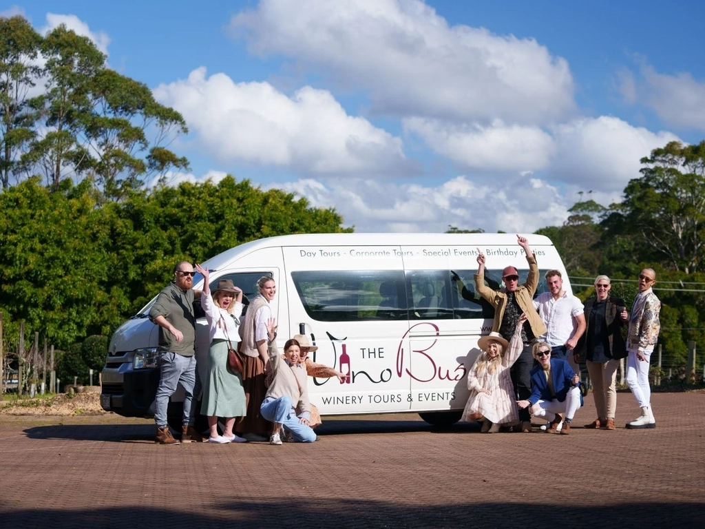 mini van with guests in front