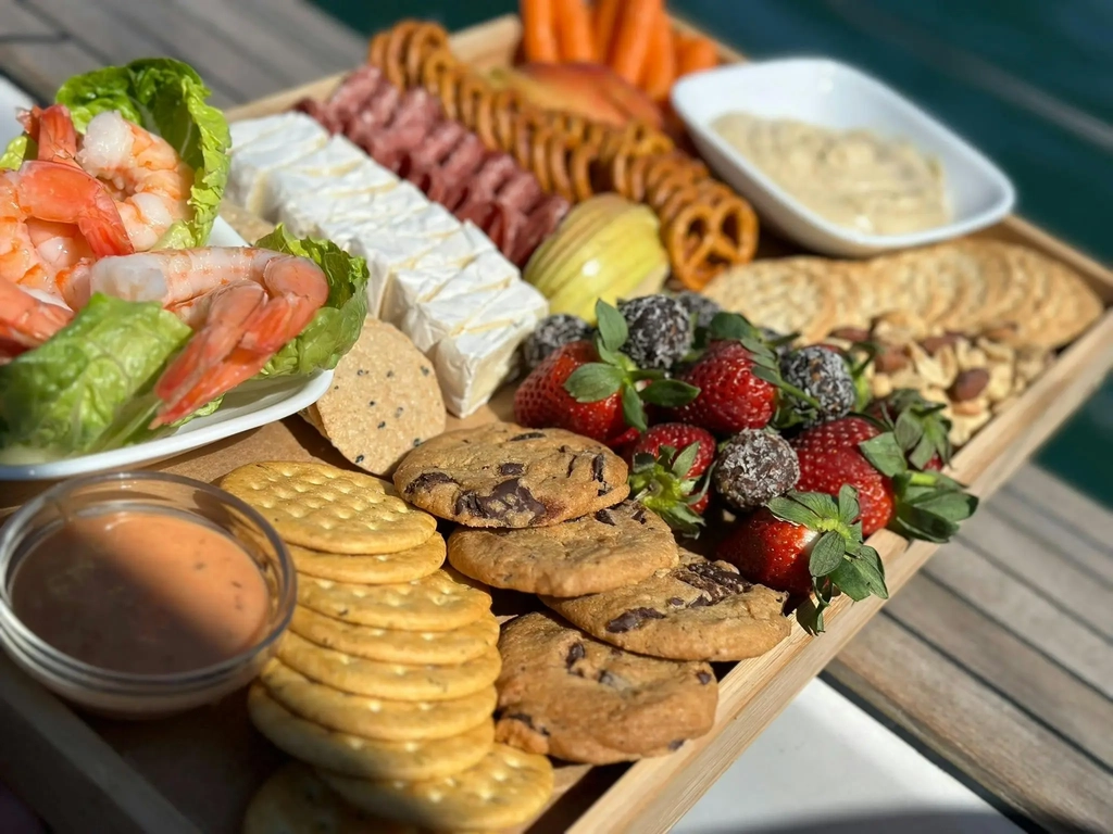 Gourmet grazing board including fresh Queensland prawns served onboard Sun Sailing's private charter