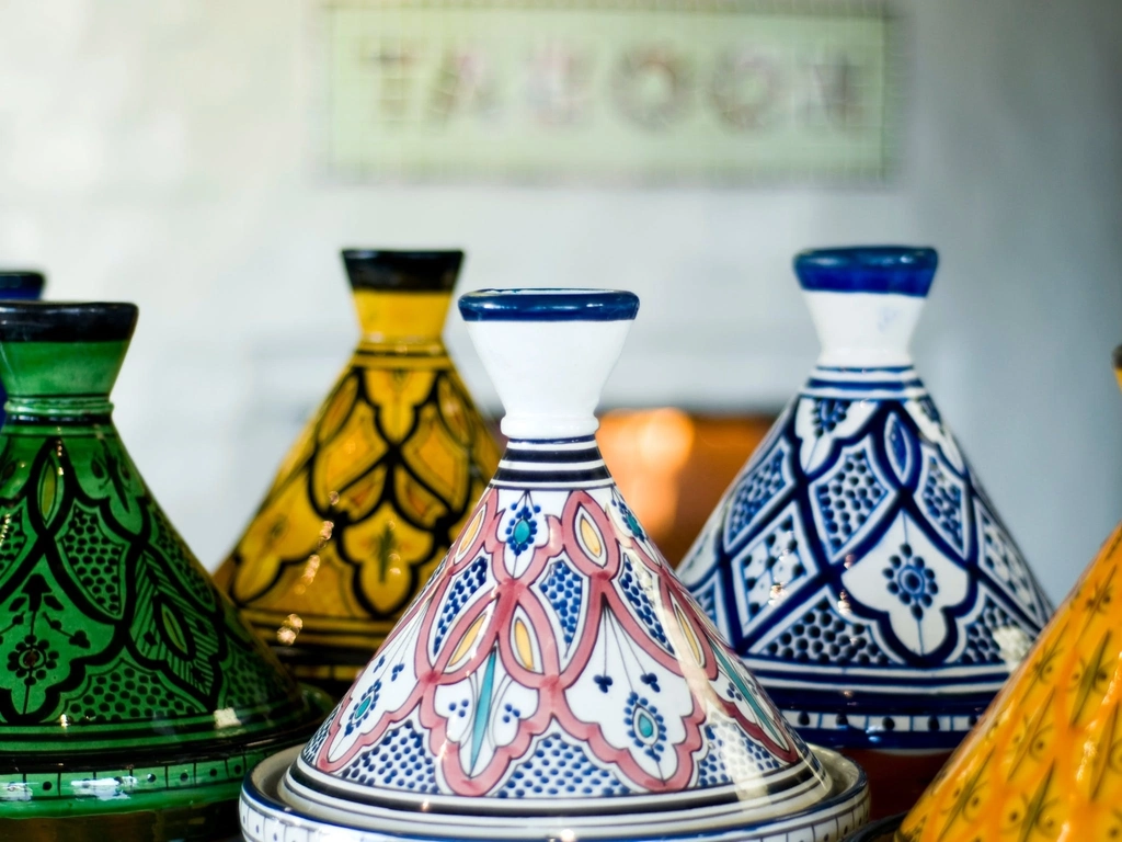 Classic hand painted Moroccan Tagines in front of The Taboon oven