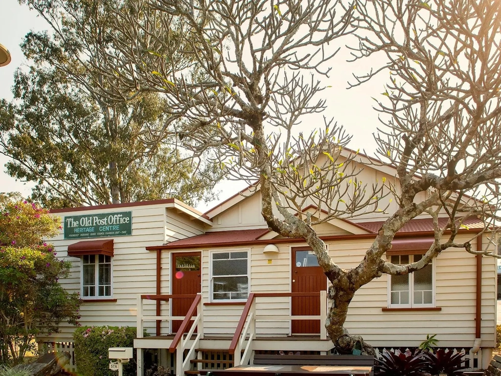 A heritage building surrounded by trees
