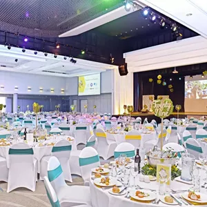 A gala lunch decorated with blue, white and gold theming