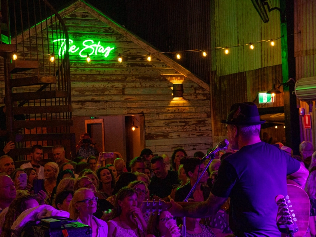 Crowd at night inside of the venue enjoying a Daryl Braithwaite show