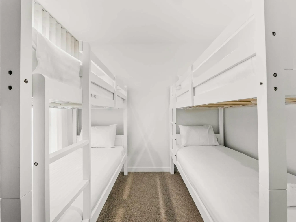 Second children's bunk room with two sets of single bunk beds