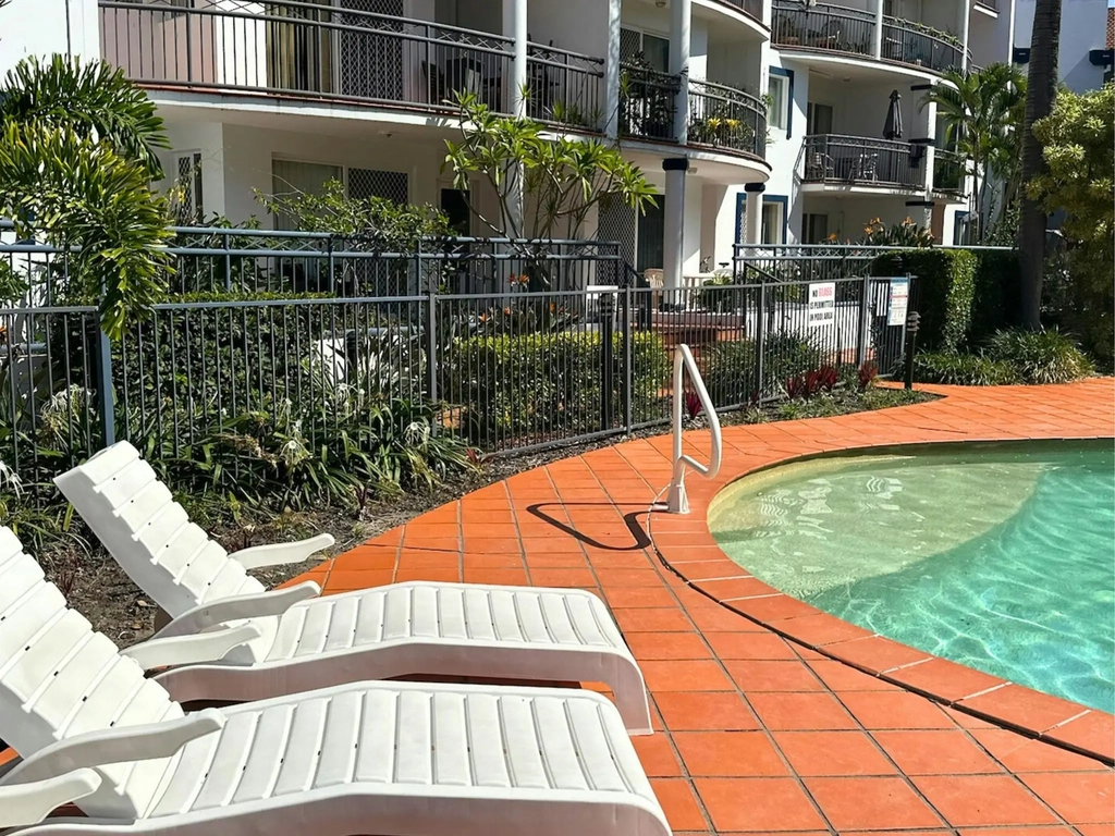 Relaxing chairs surround the Swimming Pool