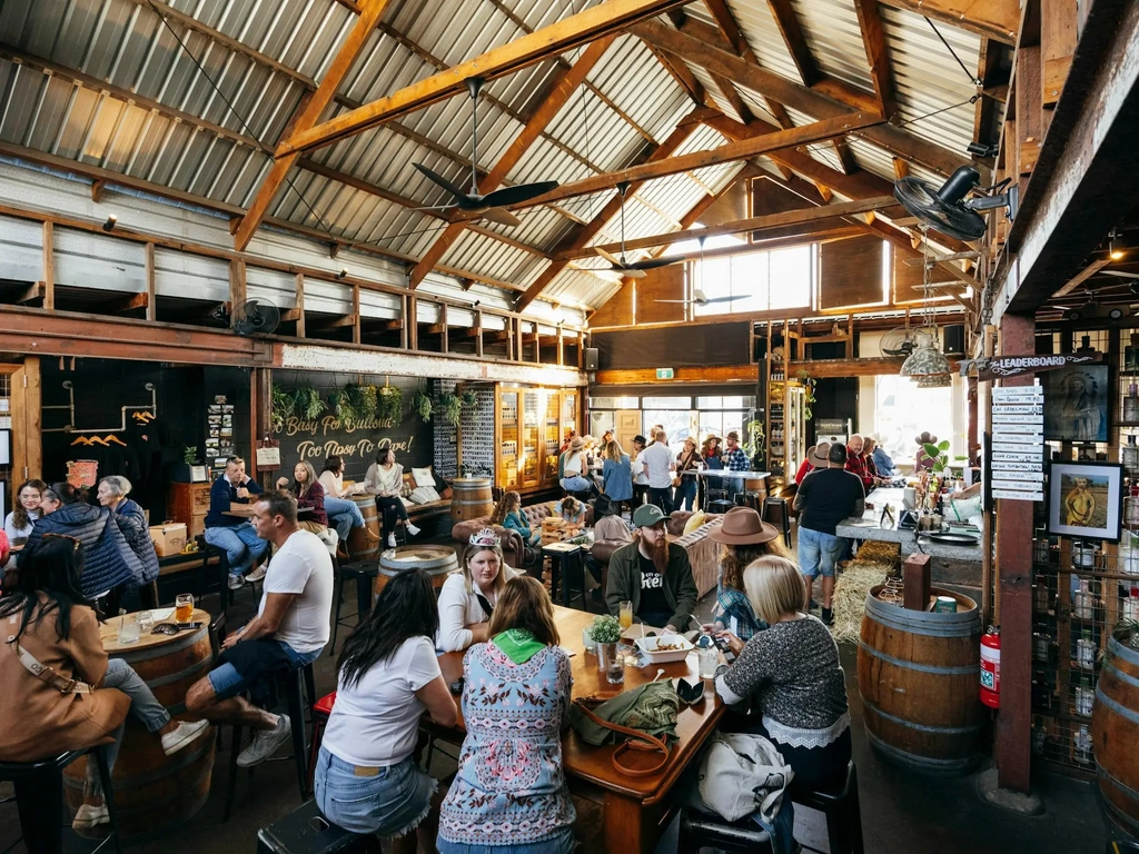 Inside Granddad Jack's Craft Distillery in Miami full of people during an event