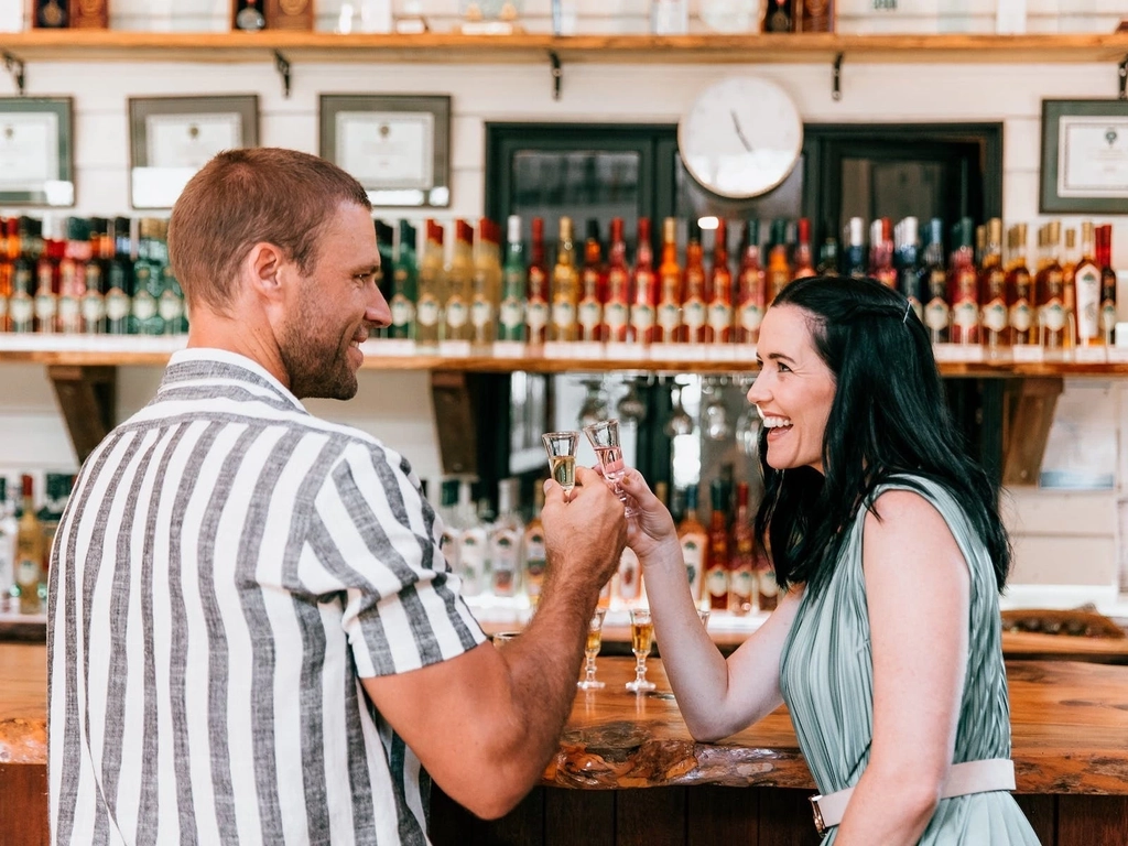 Couple tasting in front of main bar