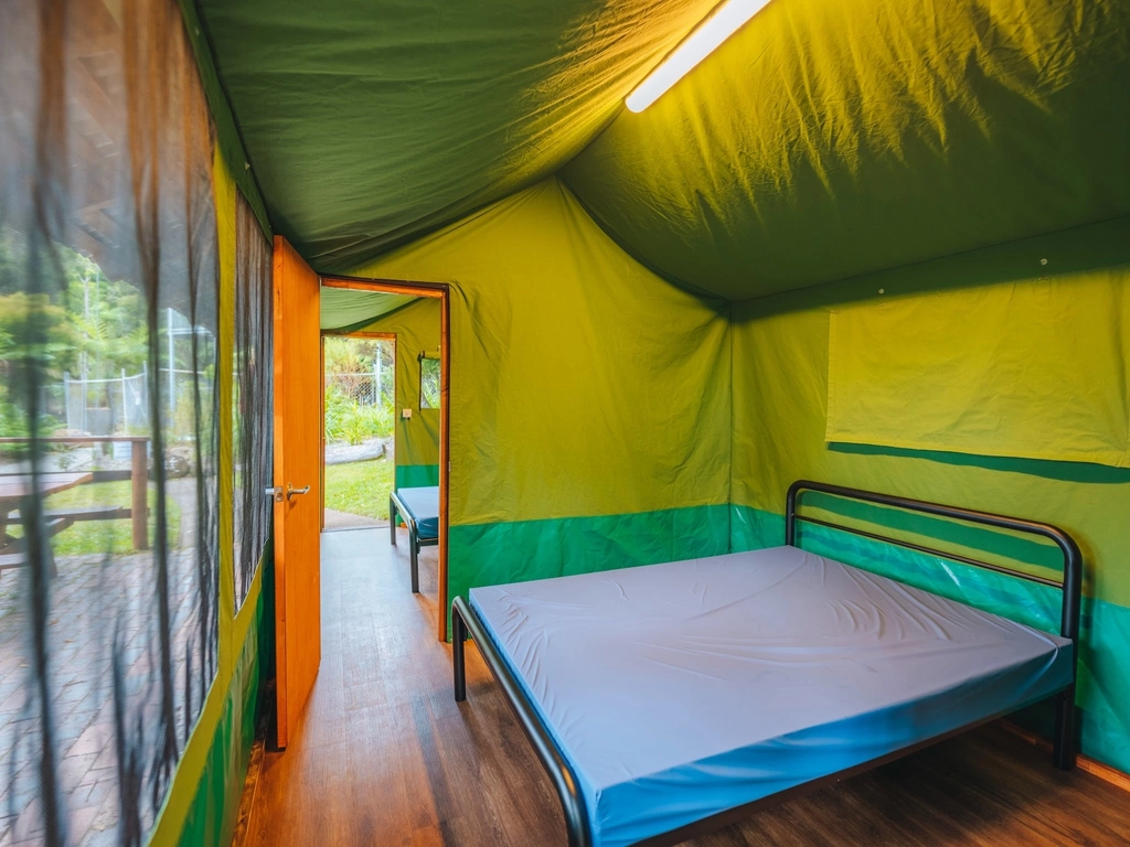 An interior image of the double bedrooms in a 'suite-style' safari tent