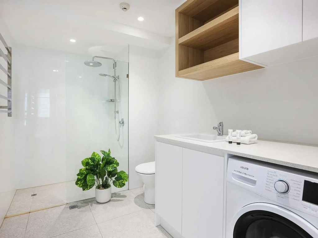 Shared bathroom with shower, toilet, laundry and dryer - Seacrest 11A Gold Coast Holidays