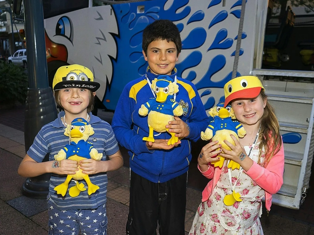 Children holding Quack'R'Duck Merch